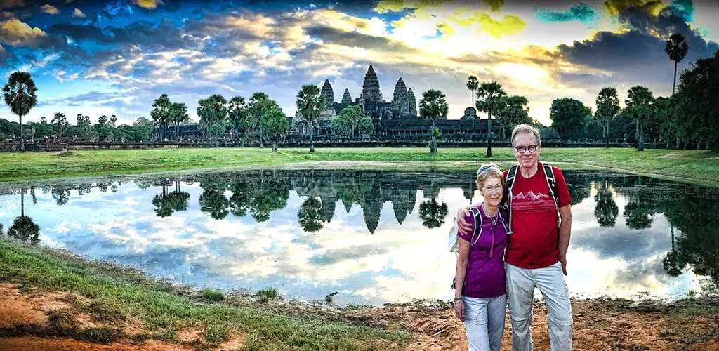 Couple posing in front of Angkor Wat