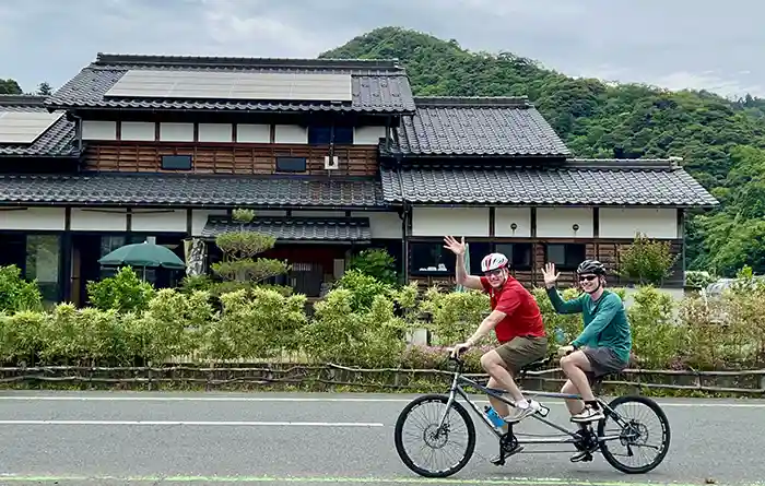 Family cycling on a tandem on the Tango Peninsula in Japan