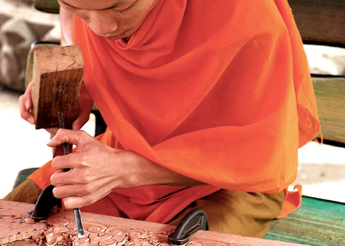 Monk carving in Laos