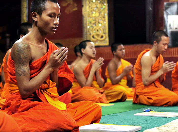 Monks praying in Luang Prabang monastery