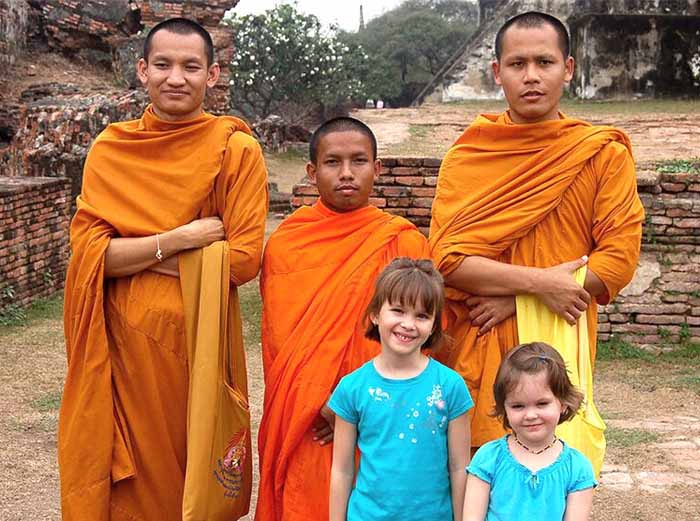 Family with monks in Thailand