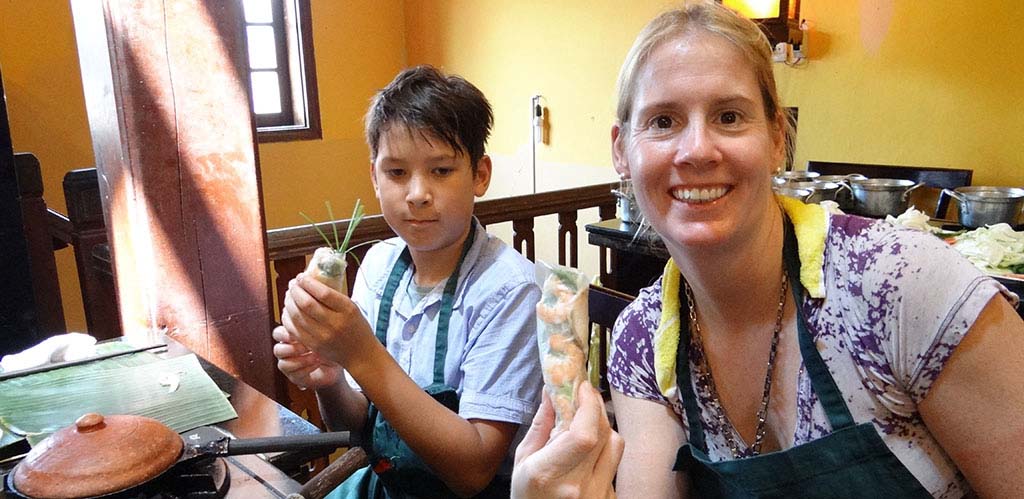 Learning to make spring rolls in cooking class in Hoi An, Vietnam