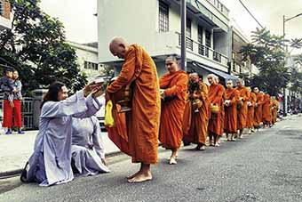 Monks during alms in Hue, Vietnam