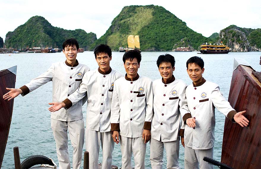 Crew aboard a luxury cruise ship on Halong Bay.