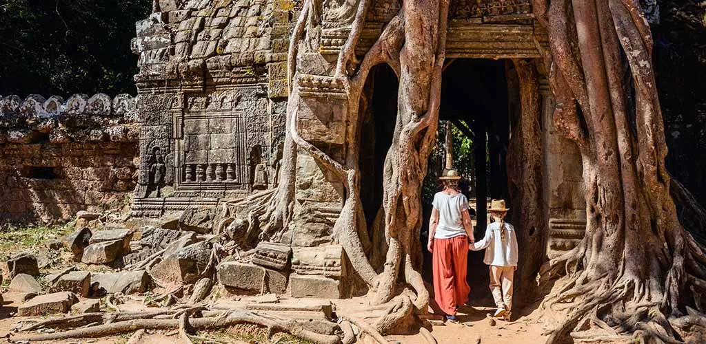 Family at Ta Phrom temple in Cambodia