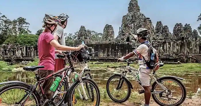 Couple on cycling tour of Angkor temples