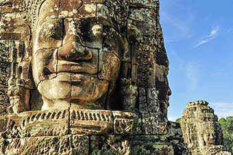 Massive stone head at the Bayon in Angkor Thom