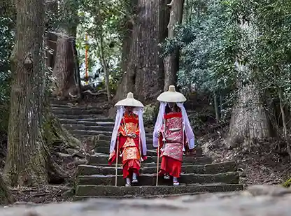 Japanese pilgrims hiking the Kumano Kodo trail