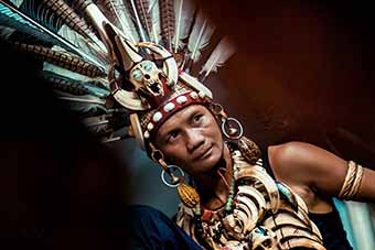 Borneo tribesman with featehr head dress