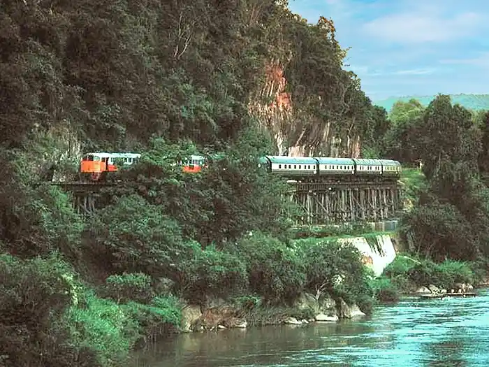 Eastern & Oriental luxury train winding along the river in Malaysia
