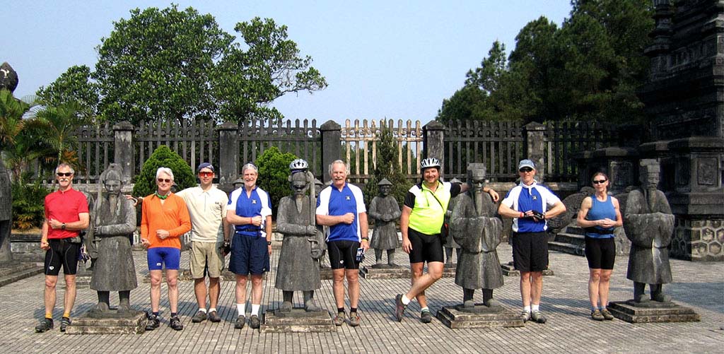 Bicyce tour group at a royal tomb in Hue Vietnam