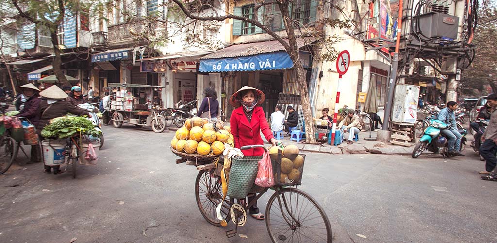 Photo taken of Coconut vendor in Hanoi's Old Quarter dusing Photography tour of Vietnam