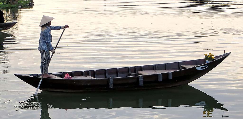 Sampan boat on Thu Bon river in Hoi An, Vietnam