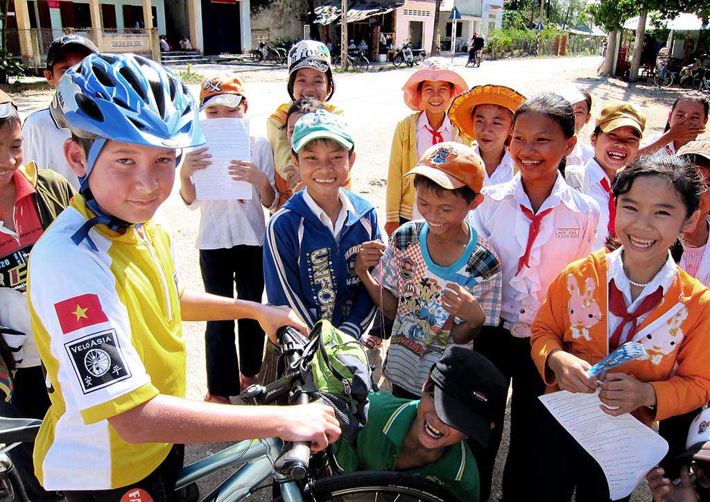 Meeting students during a family biking trip in Vietnam