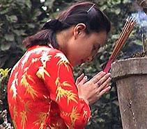Girl in prayer in Hanoi, Vietnam