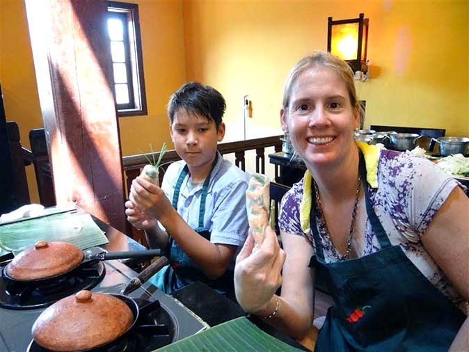 Making spirng rolls in a cooking class in Hoi An, Vietnam