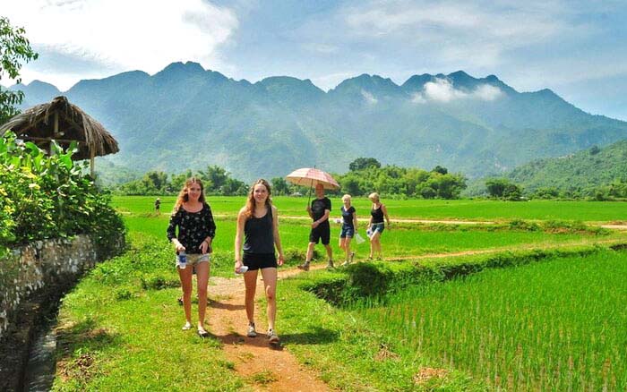 Family hiking in Mai Chau, Vietnam