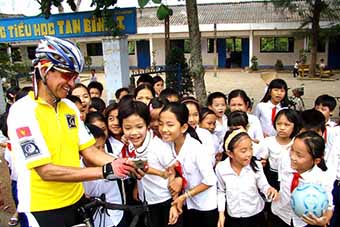 Vietnam bicycle tour rider at school