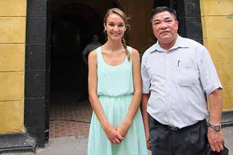Girl touring Hanoi with guide during Vietnam family trip