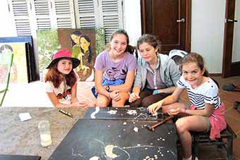Young girls learning to create lacquer art in Hanoi, Vietnam