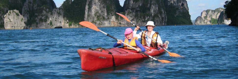 Couple kayaking on Halong Bay