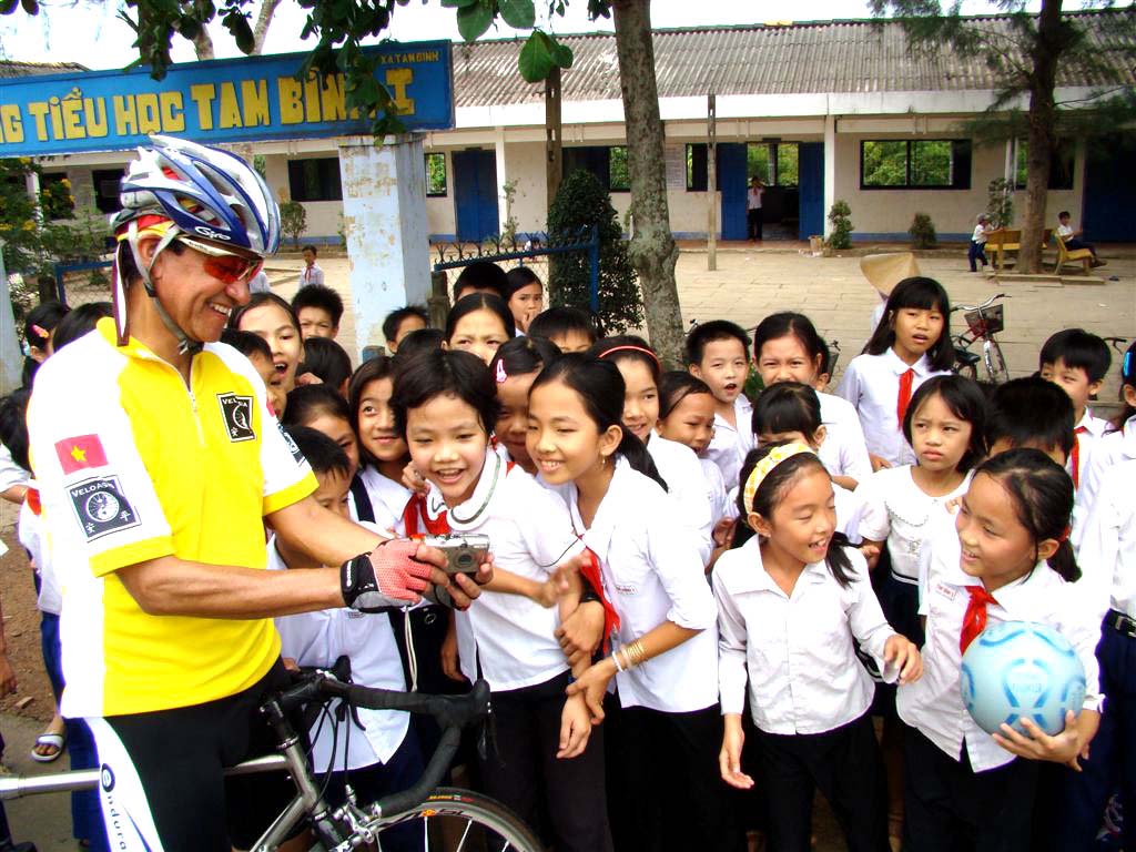 Cyclist at school in the Mekong Delta
