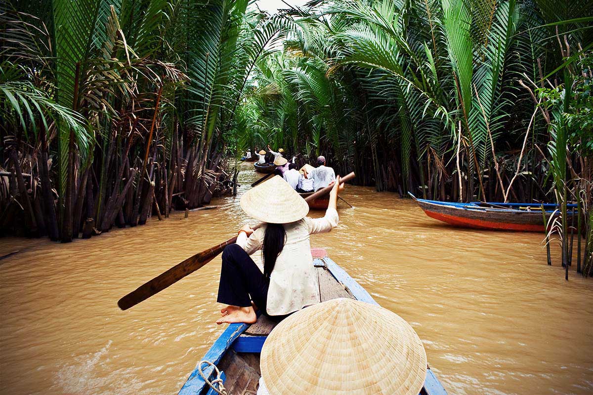 Sampan rower in the Mekong Delta