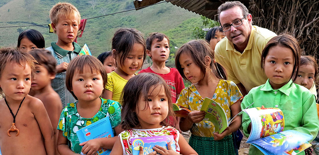 Traveler donating books at a school in Vietnam