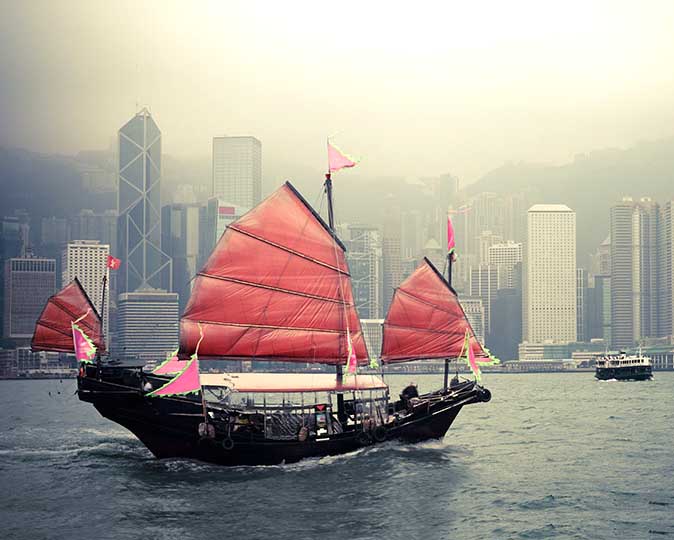 Junk sailing on Hong Kong harbor