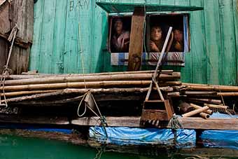 Halong Bay floating village faces
